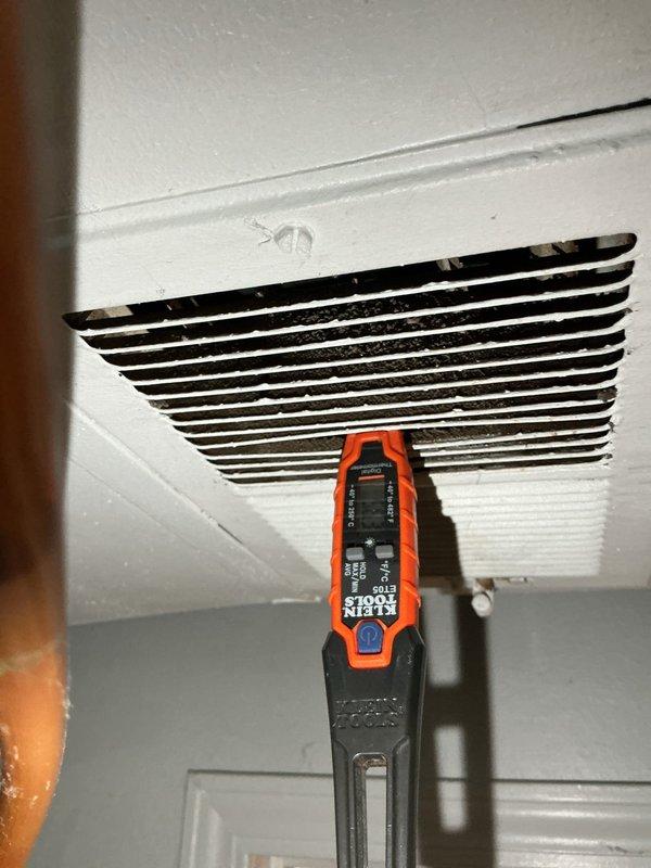 Responded to no cooling complaint on 10-year-old residential air conditioning system with ground-level condenser unit. Performed comprehensive diagnostic evaluation after unit was shut down as previously advised. Utilized digital measurement instruments to assess supply air temperature and system performance at ceiling registers. Conducted thorough testing of electrical components and airflow measurements to identify root cause of cooling deficiency.