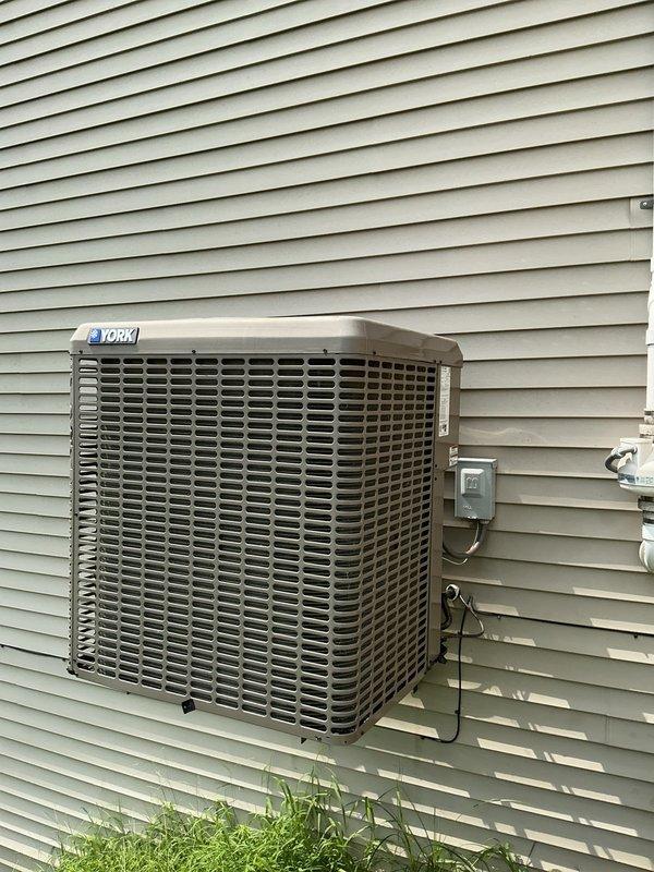 Responded to no cooling complaint on 10-year-old York condenser unit located in side yard. Upon arrival, confirmed unit was blowing warm air as reported and had been turned off per prior instructions. Performed diagnostic evaluation of outdoor condenser unit, inspecting electrical connections, refrigerant lines, and compressor operation. Documented equipment model and serial number information for service records. Identified root cause of cooling failure and completed necessary repairs to restore proper system operation. Unit tested and verified to be cooling properly upon completion.