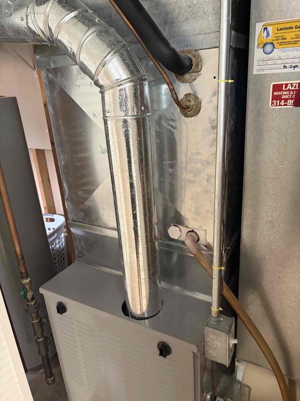 Responded to no cooling complaint on 10+ year old elevated side-mounted condensing unit. Upon arrival, performed system diagnostic and found outdoor unit not operating while indoor air handler fan continued to run as instructed. Inspected outdoor electrical disconnect, capacitor, and associated wiring connections. Evaluated refrigerant line set condition and verified proper insulation coverage. Assessed indoor air handler installation including ductwork connections and cabinet integrity. Documented equipment condition with photos of both indoor and outdoor components for service records.
