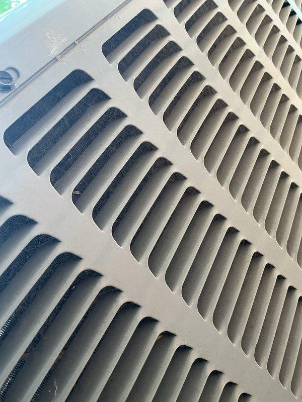 Completed comprehensive cooling system tune-up on residential air conditioning unit less than 10 years old located in backyard. Performed standard maintenance procedures including inspection of all major components, cleaned air return grille which showed moderate dust accumulation, verified system specifications and model information, and documented equipment condition with photographic records. Unit operating within normal parameters upon completion of service.