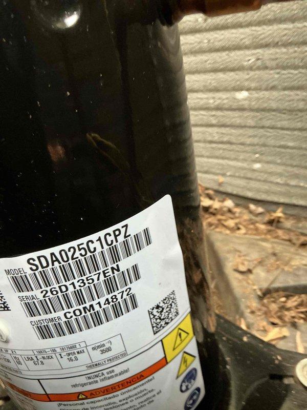 Responded to no-cooling call and replaced failed compressor (model SDA025C1CPZ) and TXV on outdoor condensing unit. Verified proper refrigerant pressures using digital manifold gauges and confirmed system operation upon completion. Documented old and new compressor faceplates per protocol and retained failed compressor for warranty processing.