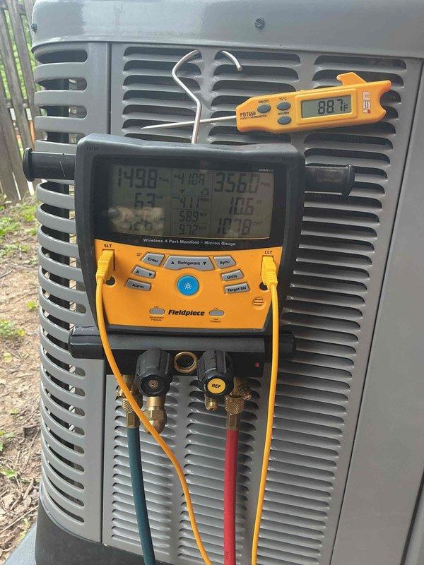 Responded to no cooling complaint on 9-year-old AC system. Upon arrival, confirmed no cold air from vents and condenser fan motor not operating. Initial inspection revealed blown fuses; replaced fuses and verified fan motor operation and cooling restored. Customer reported system failure recurred same evening with complete loss of power to outdoor unit. 

Returned for diagnostic evaluation and performed comprehensive electrical testing. Used clamp meter to measure amperage draw on compressor and fan motor circuits. Readings indicated compressor drawing 84.2 amps, significantly above normal operating range. Connected manifold gauges to measure system pressures and temperatures. Suction pressure reading 64 PSI, discharge pressure 79.8 PSI, with suction line temperature 40.8°F and discharge line temperature 89.3°F. Subcooling measured 10.6°F and superheat 35.6°F, confirming abnormal operating conditions.

Testing revealed failed run capacitor causing excessive amperage draw on compressor,