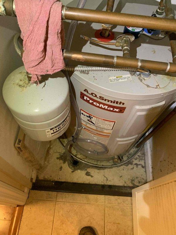 Responded to no cooling call on 2021 Carrier system that stopped operating at 8:45 PM previous evening. Upon arrival, inspected air handler and condensing unit for power and operational issues. Verified electrical connections, checked circuit breakers, and tested capacitor and contactor functionality. System restored to normal cooling operation. Documented equipment installation with photos showing air handler location and surrounding mechanical components in utility space.