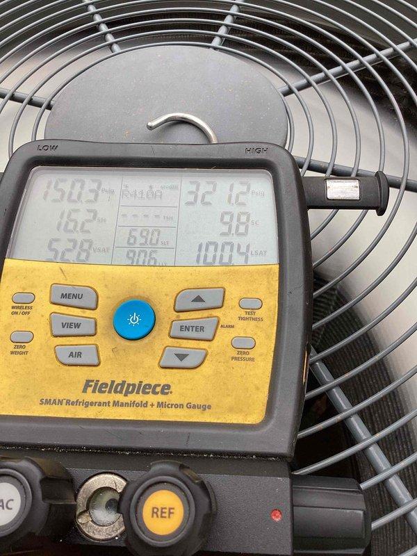 Responded to callback for 6-year-old system not maintaining desired temperature during extreme heat conditions (97°F ambient). Performed comprehensive diagnostic evaluation using refrigerant manifold and micron gauge to verify system pressures, temperatures, and overall performance following recent service work. Measured supply air temperatures and confirmed unit is operating within manufacturer specifications with proper refrigerant charge and airflow.