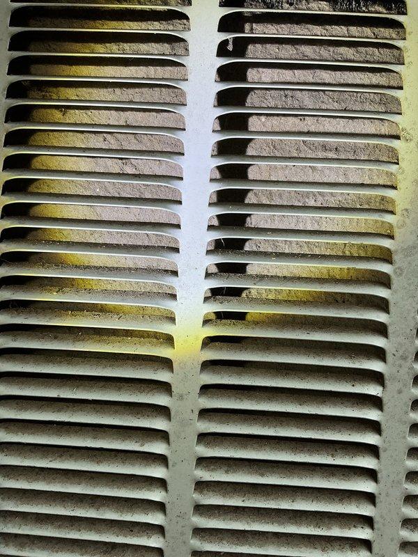 Responded to no cooling complaint on 10+ year old residential HVAC system. Upon arrival, found exterior ventilation grilles heavily contaminated with mold, algae, and biological growth, indicating significant airflow restriction and moisture intrusion. Documented extensive weathering and deterioration of exterior components, completed diagnostic evaluation, and contacted property owner with findings and recommendations for system restoration.