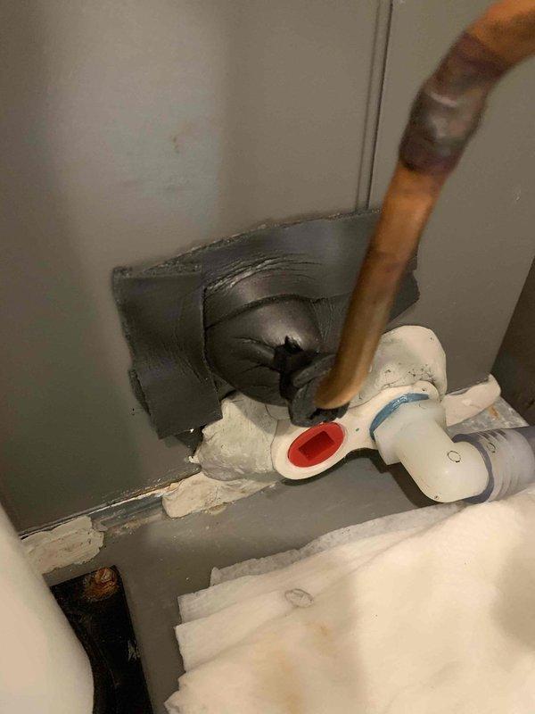 Responded to callback for second floor air conditioning unit experiencing water leakage one day after routine maintenance. Upon inspection, discovered the evaporator coil drain pan exhibited severe rust deterioration and corrosion throughout, with extensive mineral deposits indicating chronic moisture accumulation. The condensate drainage system showed signs of long-term failure, with rust staining concentrated along collection areas. Copper refrigerant lines and associated plumbing connections were inspected for integrity. Documented condition of corroded drain pan, deteriorated plumbing components, and compromised condensate management system. Unit identified as oldest system in building requiring drain pan replacement to resolve recurring leakage issue.