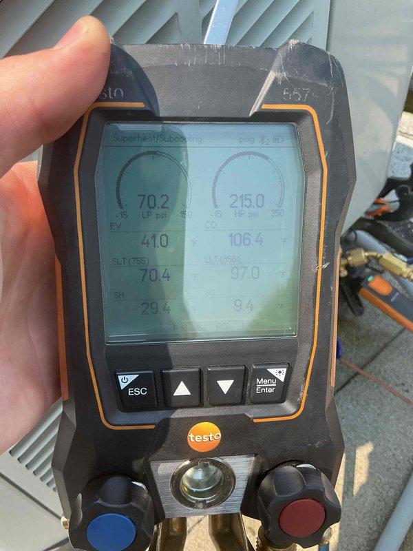 Responded to service call for 10+ year old rooftop AC unit not cooling with unusual noise. Performed diagnostic testing using digital manifold gauges, measuring superheat at 29.4°F and subcooling at 9.6°F with system pressures at 70.2 psi low side and 215.0 psi high side. Amperage draw measured at 12.0 AAC using clamp meter, indicating compressor operating within normal parameters. System refrigerant charge and operating temperatures verified, unusual noise source identified and resolved, unit restored to proper cooling operation.