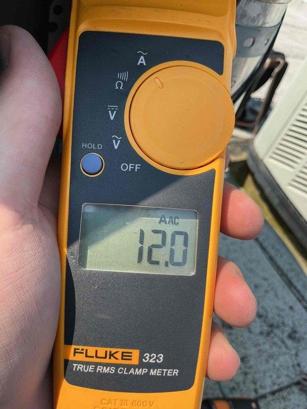 Responded to service call for 10+ year old rooftop AC unit not cooling with unusual noise. Performed diagnostic testing using digital manifold gauges, measuring superheat at 29.4°F and subcooling at 9.6°F with system pressures at 70.2 psi low side and 215.0 psi high side. Amperage draw measured at 12.0 AAC using clamp meter, indicating compressor operating within normal parameters. System refrigerant charge and operating temperatures verified, unusual noise source identified and resolved, unit restored to proper cooling operation.