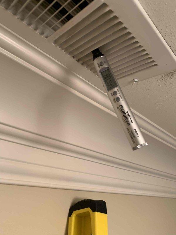 Responded to service call for AC unit not maintaining set temperature on east side system. Upon arrival, performed diagnostic assessment of the affected unit, which is part of a 4-unit system less than 10 years old. Inspected attic ductwork and found black flexible duct installation requiring evaluation. Measured supply air temperature and airflow at ceiling register using digital instruments to assess system performance. Customer had been advised to turn unit off and leave fan running prior to service visit to prevent potential compressor damage.