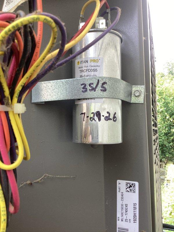 Responded to no cooling complaint on residential Lennox AC system. Upon arrival, performed diagnostic testing and found failed dual-run capacitor (35+5 MFD) preventing compressor and condenser fan motor from operating at proper capacity. Verified system pressures and temperatures using refrigerant manifold gauges, confirming inadequate cooling performance with unit unable to maintain temperature below 74°F. Replaced defective Titan PRO capacitor (TRCFD355) with new unit matching OEM specifications. Cycled system through complete operational test, verified proper amperage draw on compressor and fan motor, and confirmed refrigerant pressures within normal operating range. Unit now cooling effectively to thermostat setpoint. System restored to full operational status.