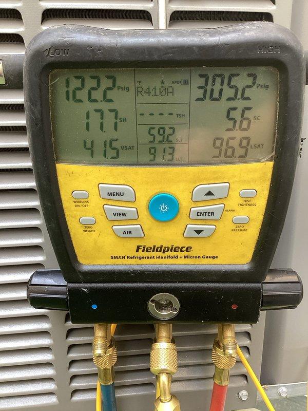 Responded to no cooling complaint on residential Lennox AC system. Upon arrival, performed diagnostic testing and found failed dual-run capacitor (35+5 MFD) preventing compressor and condenser fan motor from operating at proper capacity. Verified system pressures and temperatures using refrigerant manifold gauges, confirming inadequate cooling performance with unit unable to maintain temperature below 74°F. Replaced defective Titan PRO capacitor (TRCFD355) with new unit matching OEM specifications. Cycled system through complete operational test, verified proper amperage draw on compressor and fan motor, and confirmed refrigerant pressures within normal operating range. Unit now cooling effectively to thermostat setpoint. System restored to full operational status.
