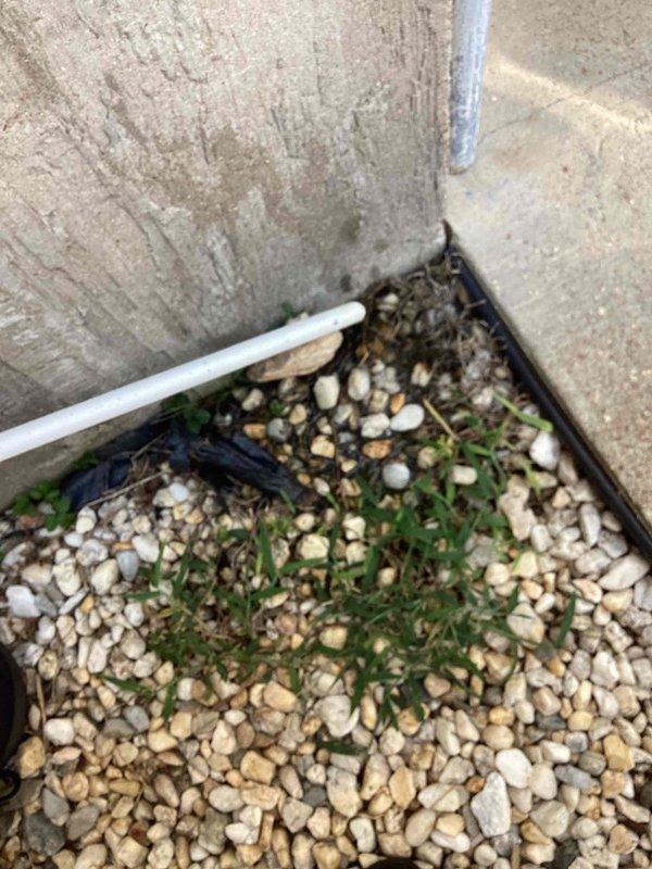 Responded to service call for air conditioning unit leaking water onto floor. Upon inspection, found deteriorated pipe insulation on refrigerant lines and condensate drainage issues at exterior unit located at side of home. Replaced damaged insulation wrap on refrigerant piping and addressed condensate line drainage to resolve active water leak.