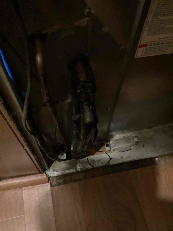 Responded to service call for air conditioning unit leaking water onto floor. Upon inspection, found deteriorated pipe insulation on refrigerant lines and condensate drainage issues at exterior unit located at side of home. Replaced damaged insulation wrap on refrigerant piping and addressed condensate line drainage to resolve active water leak.