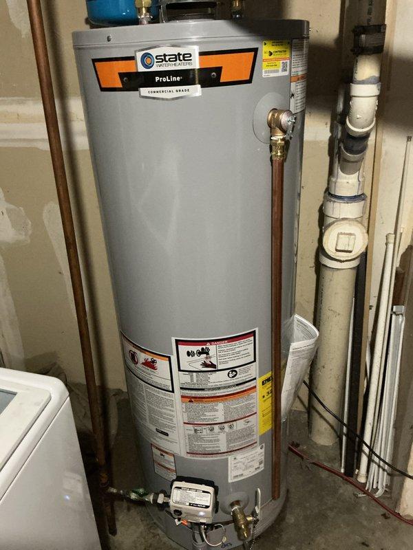 Completed installation of 40-gallon State ProLine commercial-grade gas water heater in residential utility room. Installed new 3/4-inch pressure reducing valve and blue expansion tank with proper copper piping connections and brass fittings to top of unit. Replaced two exterior hose bibs as requested on time and materials basis. Connected all hot and cold water supply lines using copper pipe with appropriate shut-off valves. Installed proper venting system with metal ductwork for exhaust gases. Verified all gas connections secure and tested unit for proper operation. All plumbing connections pressure tested and confirmed leak-free.