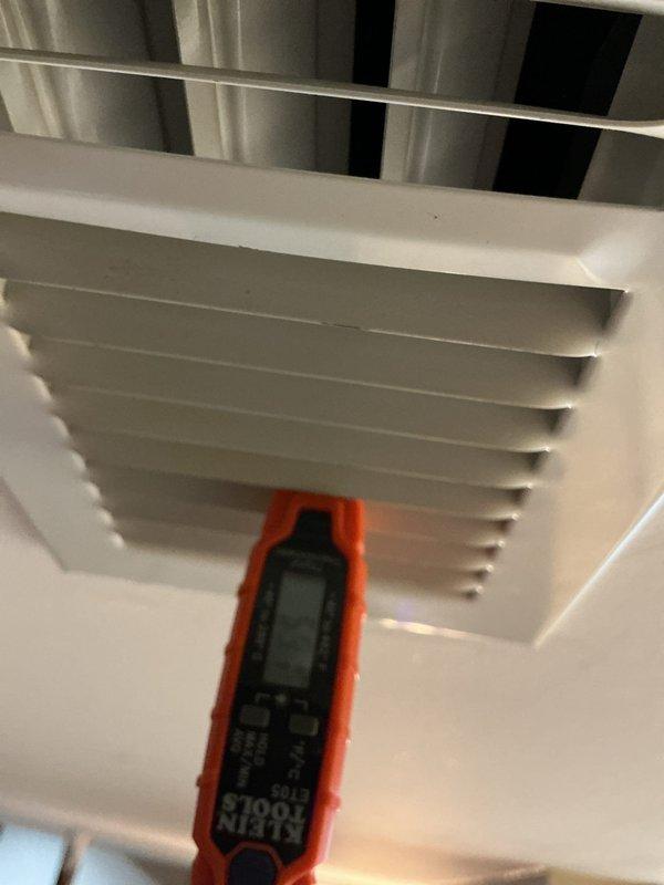 Responded to recall for 10-year-old AC unit not cooling with indoor temperature at 78 degrees. Upon arrival, unit was shut off. Performed diagnostic testing using digital multimeter at supply register and measured airflow temperatures at ductwork in attic space. Inspected HVAC system components, took temperature and system performance readings at multiple points including ceiling diffuser and main trunk line. Completed diagnostic assessment and documentation of system conditions. Unit evaluated and measurements recorded for proper cooling performance verification.