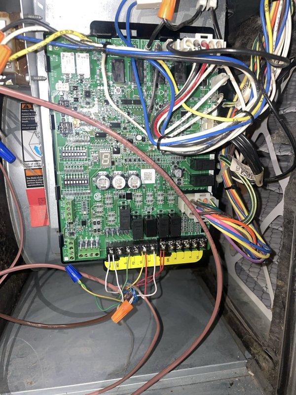 Responded to no cooling complaint following power restoration. Upon inspection, found control board wiring connections compromised. Inspected circuit board terminals and wire connections at terminal strip, verified proper wire routing and secure connections to control board. Tested system operation, restored cooling functionality, and confirmed all electrical connections were properly seated and secure.