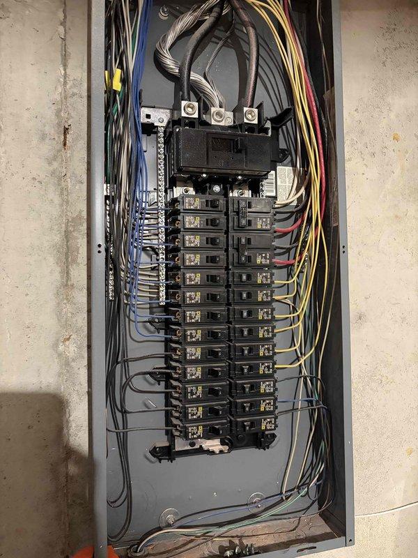 Completed comprehensive whole home electrical inspection with 30-minute advance notification as requested. Thorough evaluation included exterior utility meter installation, main electrical panel, circuit breaker configuration, and overall system integrity. Documented all findings with detailed photography of the meter assembly mounted on exterior brick wall and main service panel showing organized wire management, proper color-coding of conductors, and breaker arrangement. All components were found to be professionally installed with appropriate wire routing and connections at main disconnect and individual circuit breakers.