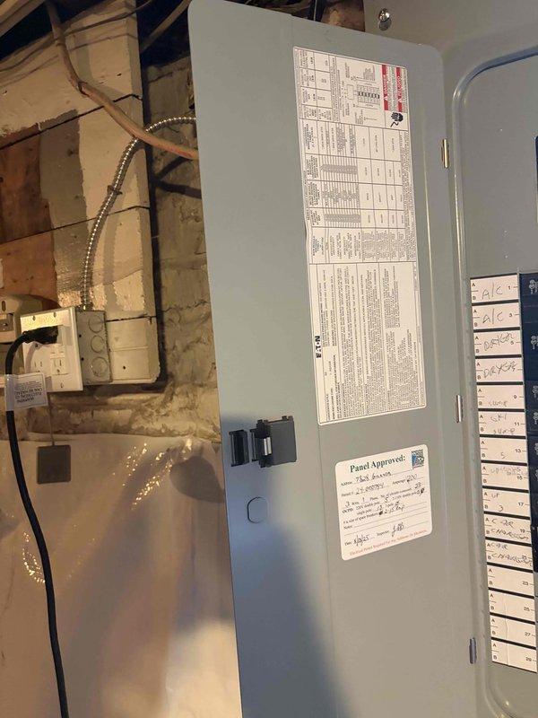 Responded to service call for ceiling fan that burned out with suspected wiring short and warm ceiling. Upon inspection, traced circuit to electrical panel and verified proper breaker operation and circuit integrity. Documented panel configuration and circuit labeling for service records. All electrical connections found secure with no evidence of overheating or short circuit conditions at panel level.