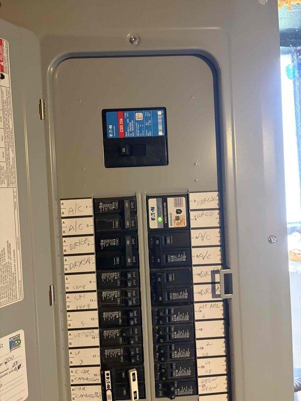 Responded to service call for ceiling fan that burned out with suspected wiring short and warm ceiling. Upon inspection, traced circuit to electrical panel and verified proper breaker operation and circuit integrity. Documented panel configuration and circuit labeling for service records. All electrical connections found secure with no evidence of overheating or short circuit conditions at panel level.