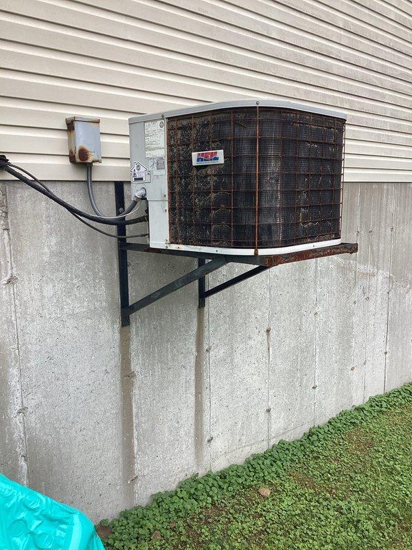 Responded to no cooling complaint on 10+ year old residential AC unit maintaining 83°F with outdoor fan running. Upon inspection, diagnosed failed dual run capacitor (TITAN THORP355 35/5 MFD rated 440/370V) in outdoor condensing unit. Replaced defective capacitor with new component, restored proper compressor and condenser fan motor operation, and verified system cooling performance.