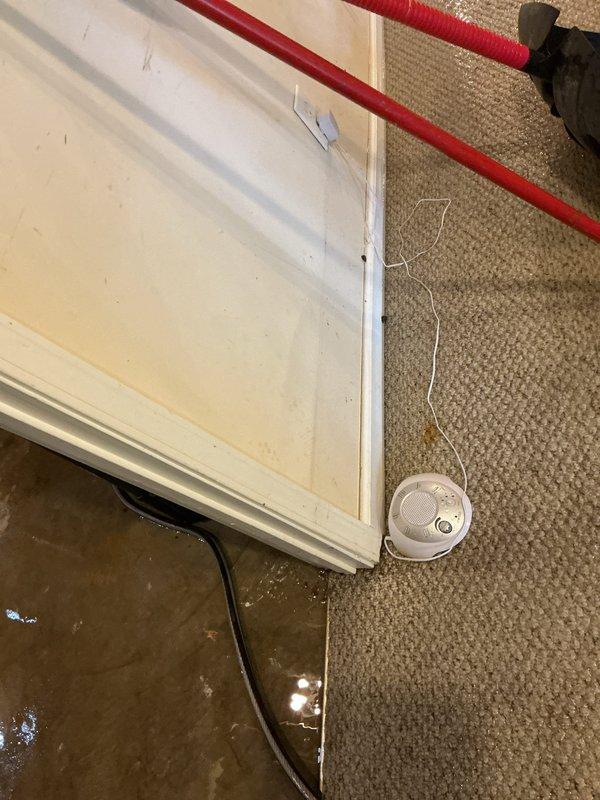 Responded to no-cool call on 2016 Lennox system with reported furnace shutdown and flooded condensate basin. Upon arrival, found significant water accumulation on floor near HVAC unit due to condensate drain line blockage or pan overflow. Accessed main control board and verified system status following customer's Lennox alert notification regarding furnace shutdown. Cleared condensate blockage, tested drain line flow, and restored proper drainage function. Inspected control board wiring and connections for any water damage or corrosion. Cycled system through operational tests to confirm proper startup sequence and verified all safety controls functioning correctly. Unit restored to normal cooling operation with no further shutdown alerts.