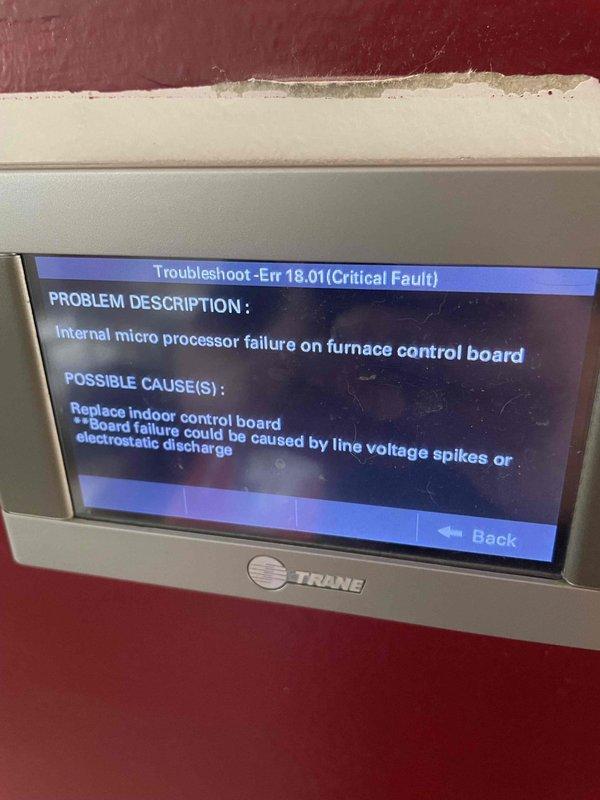 Responded to no cooling call on 9-year-old ground-level unit displaying error code 018.01. Upon arrival, diagnosed critical fault Err 18.01 indicating internal microprocessor failure on furnace control board. System also displayed secondary error code 91.00 for blower communication error, confirming loss of communication between serial communicating blower motor and indoor control board. Determined indoor control board had failed, likely due to line voltage spikes or electrostatic discharge. Replaced defective furnace control board with new unit. Restored power, cleared fault codes, and verified proper communication between all system components. Cycled unit through complete heating and cooling operations to confirm successful repair. System now operating normally with all error codes resolved and proper communication established between control board and variable-speed blower motor.