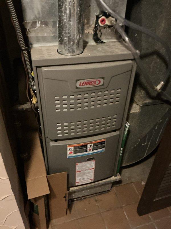 Completed routine cooling season tune-up on 12-year-old Lennox air conditioning system. Performed comprehensive maintenance including inspection of outdoor condensing unit, verified refrigerant charge and pressures, checked electrical connections and amp draw on compressor and condenser fan motor, cleaned condenser coils, and tested system operation under load. Inspected indoor air handler and noted moderately soiled pleated air filter with dust accumulation requiring replacement for optimal airflow and system efficiency. Replaced filter, confirmed proper airflow at supply registers, and verified thermostat operation in cooling mode. System operating within manufacturer specifications with no deficiencies noted at time of service.