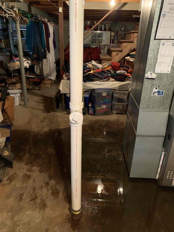 Performed camera inspection of sewer lateral line in response to basement flooding. Inspection revealed significant deterioration of pipe interior at approximately 42'10", including exposed substrate material and debris accumulation on pipe floor. Completed all required county paperwork on-site for sewer lateral program documentation and submission.