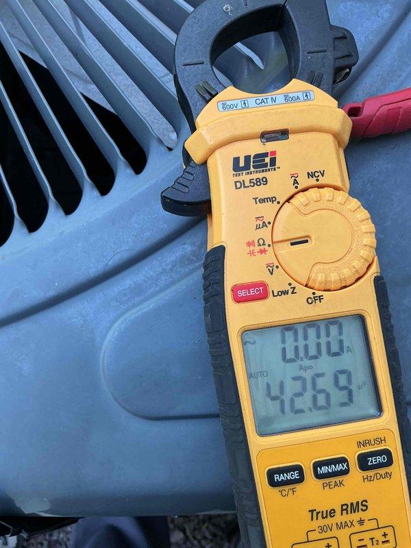 Completed comprehensive cooling tune-up on Coleman AC unit located at rear of property. Performed standard maintenance protocol including system inspection, electrical diagnostics with amperage readings, and operational testing. Unit operating within normal parameters with measured current draw of 4.269 amps, indicating proper compressor function and system efficiency.