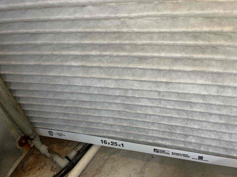 Completed preventative maintenance tune-up on a 5-year-old ground-level AC unit located in the backyard. Inspected and documented the condition of the 16x25x1 air filter, which showed moderate dust and dirt accumulation, and examined the control board and electrical connections within the unit, confirming all wiring and components were secure and functioning properly.