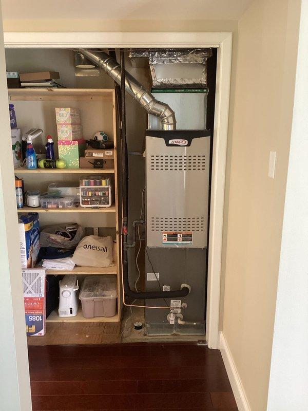 Replaced defective evaporator coil under warranty on residential Lennox furnace system located in utility closet. Uninstalled existing furnace unit to access and remove failed coil, installed new evaporator coil (S/N T22A04858), reassembled system, and verified proper heating and cooling operation upon completion.