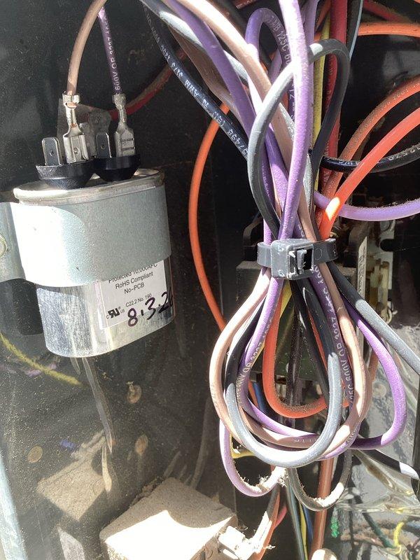 Returned to complete HVAC unit repair by replacing both the condenser fan motor (CFM) and fan blade as originally specified. Corrected previous service order that had only included motor replacement. Removed and disposed of defective components, verified proper installation of new motor and blade assembly, and confirmed system operation with capacitor connections secure.