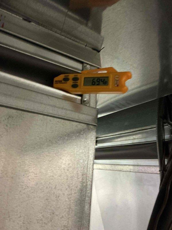 Responded to pre-sale inspection request for second-floor air conditioning unit not reaching proper temperature. Performed comprehensive system evaluation including temperature differential measurements across supply ductwork and air handling unit. Utilized digital thermometer to verify supply air temperatures at 69°F and assessed airflow distribution through metal ductwork system. Inspected air handler installation, duct connections, and insulation integrity in mechanical space to identify potential cooling deficiencies affecting second-floor temperature control.