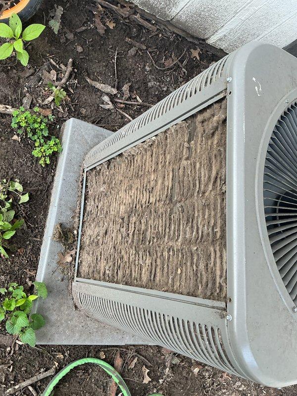 Performed comprehensive AC tune-up on outdoor condensing unit of unknown age. Inspected and cleaned heavily soiled evaporator coil which showed significant accumulation of dirt, dust, and debris in vertical patterns, indicating extended period without maintenance. Replaced dirty air filter showing visible discoloration and dust buildup. Completed standard maintenance procedures including inspection of electrical connections, refrigerant levels, and overall system operation. Unit returned to normal operating condition with improved airflow efficiency following coil cleaning and filter replacement.