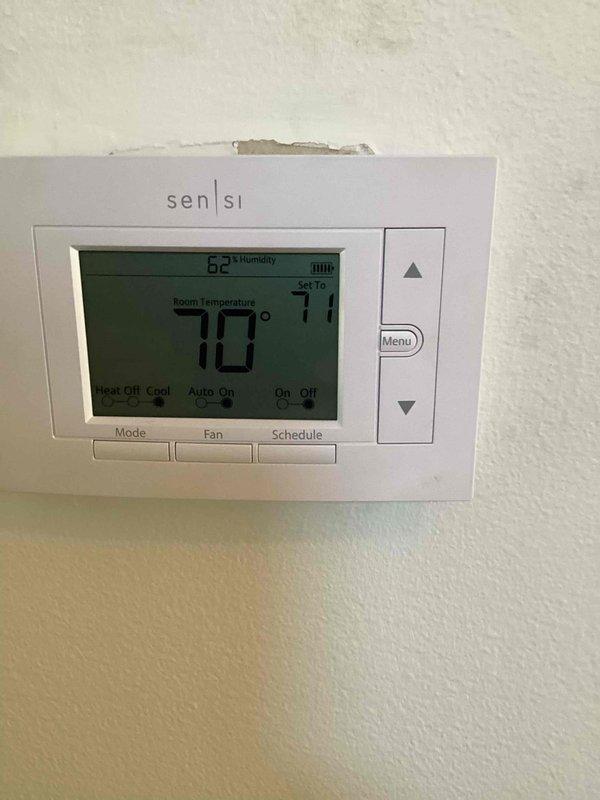Responded to callback for excessive humidity levels (60-70%) in home with customer reporting concerns about humidifier malfunction. Upon inspection, found significant condensation and moisture accumulation throughout the ductwork and air handling unit in basement. Thermostat confirmed elevated indoor humidity reading of 62% with system set to 71°F. Inspected HVAC unit #10 and documented moisture conditions inside ductwork showing water droplets across metal surfaces and panels. Assessed humidifier operation and duct system for proper moisture control functionality.