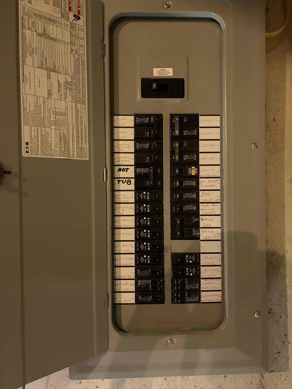 Replaced damaged 20-amp single-pole Eaton circuit breaker in main electrical panel that was broken during home inspection. The 13-year-old breaker was successfully removed and a new compatible breaker was installed, restoring proper circuit protection and functionality to the affected circuit.
