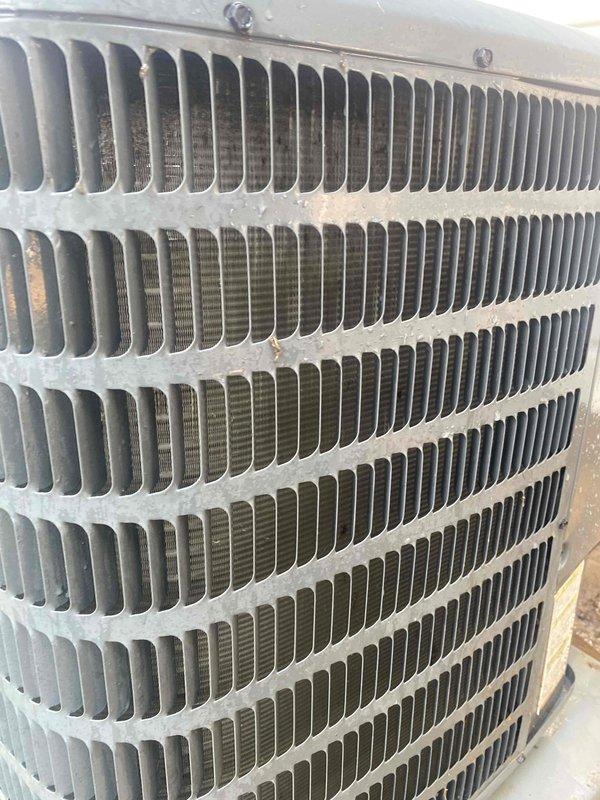Completed cooling tune-up on single outdoor condenser unit located in side yard. Unit is under 10 years old and showed moderate accumulation of dirt and debris between coil fins. Performed standard maintenance protocol including inspection of all accessible components, cleaning of condenser coils, and verification of proper system operation.