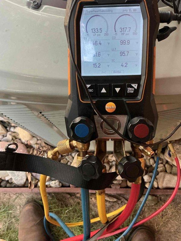 Responded to no cooling complaint on residential HVAC system over 10 years old located in side yard. Upon arrival, found air handler with heavily soiled return air filter restricting airflow. Performed system diagnostics using digital manifold gauges, revealing operating pressures of 133.5 psi low side and 317.7 psi high side with temperature readings of 46.4°F and 99.9°F. Evaluated superheat and subcooling values to assess refrigerant charge and system performance. Identified restricted airflow due to clogged filter as primary cause of inadequate cooling and system's inability to maintain setpoint temperature. Documented equipment condition with photos showing significant dust accumulation on filter media and current system pressures. Advised customer of findings and recommended filter replacement to restore proper airflow and system efficiency.