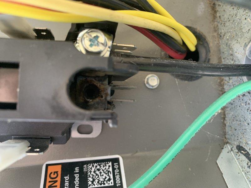 Responded to no-cool complaint on residential cooling system less than 10 years old. Upon inspection, discovered significant rust and corrosion at electrical terminal connections, which was causing poor electrical contact and preventing proper system operation. Documented deteriorated wiring terminals and corroded junction area with photographs. Advised customer to keep unit off until repairs could be completed to prevent potential electrical hazards and further damage to components.