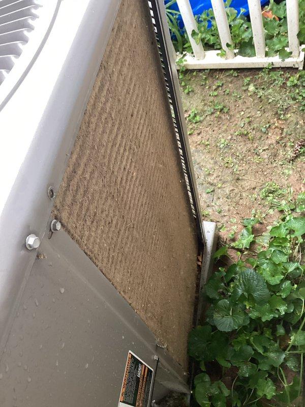 Performed comprehensive cooling system tune-up on outdoor condenser unit located in backyard. Unit exhibited significant dirt and debris accumulation on air filter/intake panel and condenser coils, which were heavily soiled and restricting proper airflow. Cleaned condenser coils and replaced/cleaned air filter to restore optimal system efficiency and heat transfer capability.