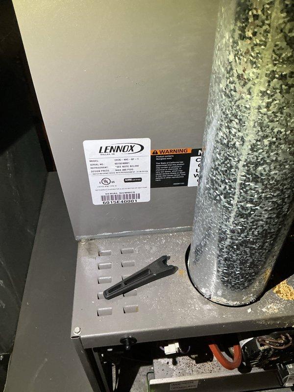 Completed comprehensive cooling season tune-up on 9-year-old Lennox air conditioning system. Performed standard maintenance protocol including inspection of air handler unit, electrical connections, control board, and ductwork connections. Observed moisture accumulation and water staining on concrete floor beneath unit, indicating potential condensate drain issue requiring monitoring or future attention.