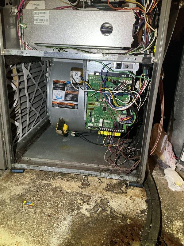 Completed comprehensive cooling season tune-up on 9-year-old Lennox air conditioning system. Performed standard maintenance protocol including inspection of air handler unit, electrical connections, control board, and ductwork connections. Observed moisture accumulation and water staining on concrete floor beneath unit, indicating potential condensate drain issue requiring monitoring or future attention.
