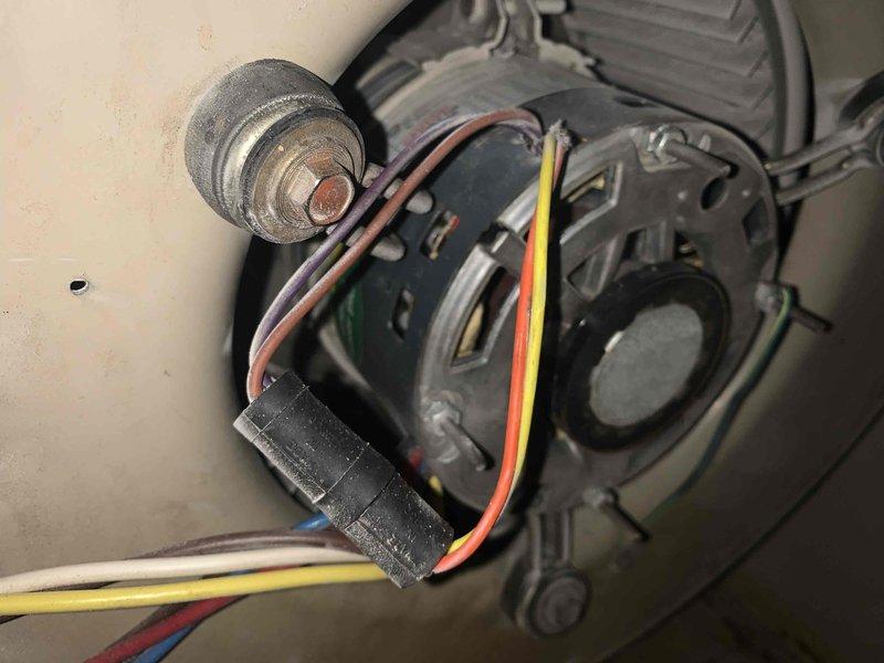 Completed comprehensive preventive maintenance tune-up on a cooling system over 10 years old located in side yard. Performed full system inspection including air handler components, blower motor assembly, electrical connections, and return air grille. Verified proper operation of blower motor, inspected capacitor for signs of wear, and checked all electrical connections for secure contact. Documented equipment condition with photos showing internal components and air distribution system.