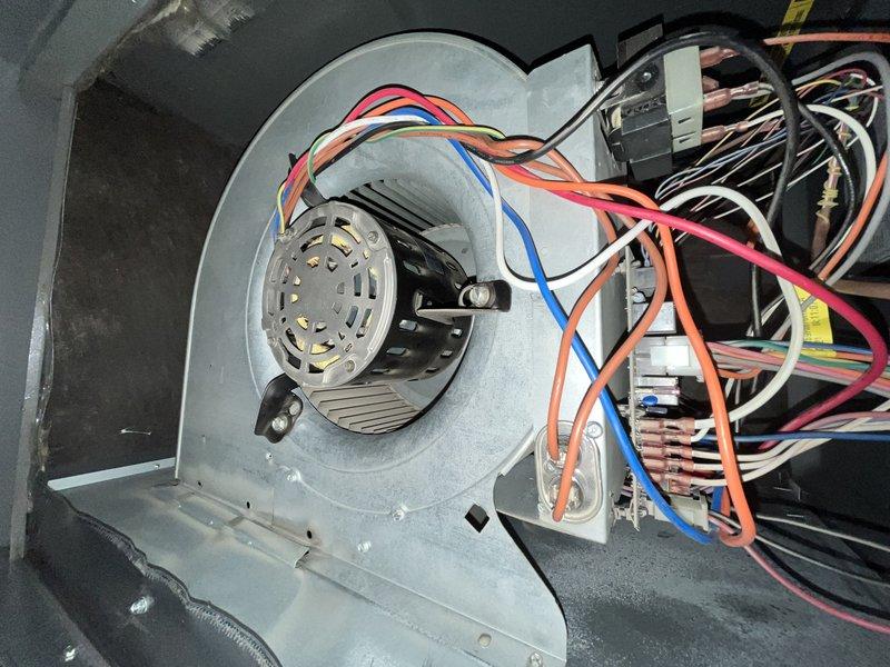 Completed comprehensive cooling system tune-up on single ground-level outdoor AC unit. Performed electrical diagnostics using digital multimeter, recording voltage readings at 100.5VAC to verify proper power supply to system. Inspected blower assembly and motor within air handler unit, confirmed all electrical connections secure, and verified centrifugal fan wheel operation and airflow performance meets manufacturer specifications.