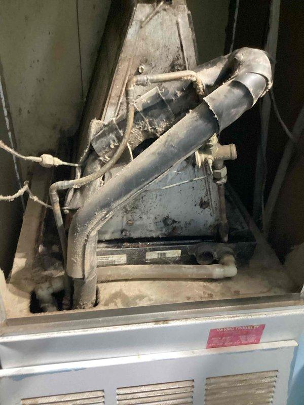 Responded to no cooling complaint on 10+ year old system with outdoor condenser unit and indoor air handler. Upon arrival, performed diagnostic evaluation of both indoor and outdoor components. Inspected aged air handler located in confined mechanical space showing normal wear and dust accumulation. Evaluated outdoor condenser unit positioned on ground-level pad with visible weathering consistent with age. System had been turned off overnight per customer report. Following troubleshooting procedures, identified issue and restored cooling operation to unit. Per special instructions, ensured thermostat was set to fan-on mode with AC function temporarily disabled as requested.
