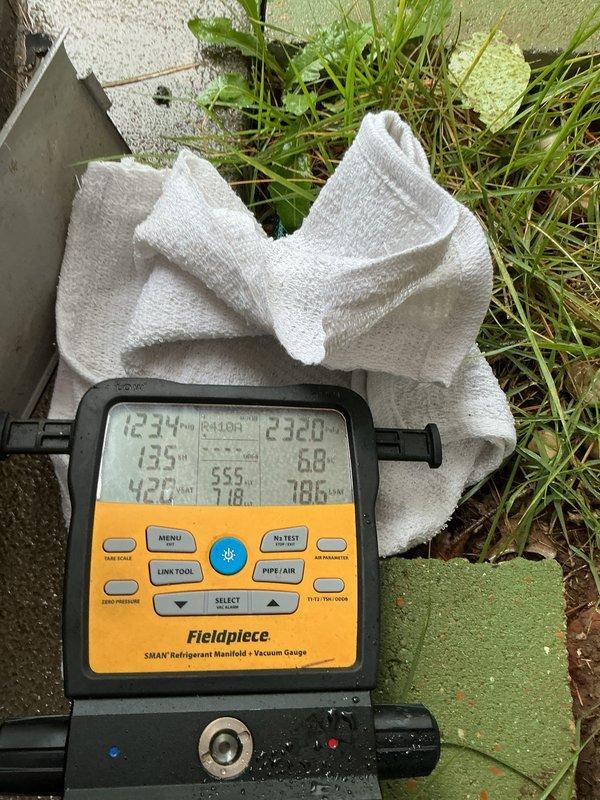 Completed comprehensive cooling system tune-up on 5-year-old ground-level AC unit. Performed refrigerant pressure and temperature diagnostics using manifold gauge set, confirming system operating within manufacturer specifications. Inspected indoor air handler components including blower motor assembly and verified proper electrical connections throughout system.