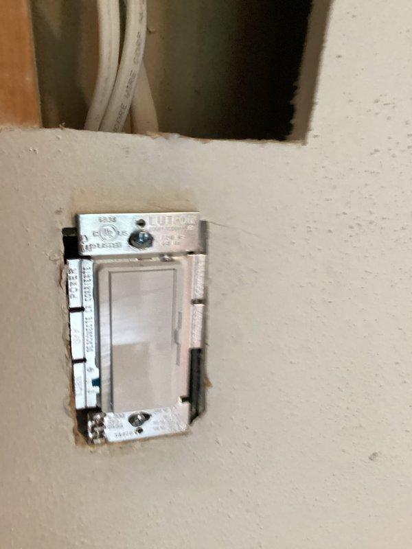 Completed initial electrical installation for kitchen remodeling project. Installed new dimmer switch with proper mounting and wiring connections in wall cavity, ensuring secure placement within electrical box. Performed rough-in wiring work to support cabinet and lighting infrastructure for kitchen renovation phase.
