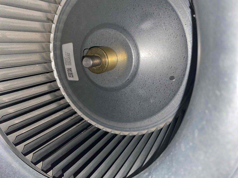 Completed comprehensive cooling tune-up on outdoor AC unit located in backyard. Upon inspection, condenser coils showed significant accumulation of dirt and debris throughout fins, requiring thorough cleaning to restore proper airflow and heat transfer efficiency. Exterior housing exhibited weathering, discoloration, and algae growth, which was addressed during service. Inspected blower wheel assembly and verified proper operation of all mechanical components. Unit returned to optimal operating condition following maintenance procedures.