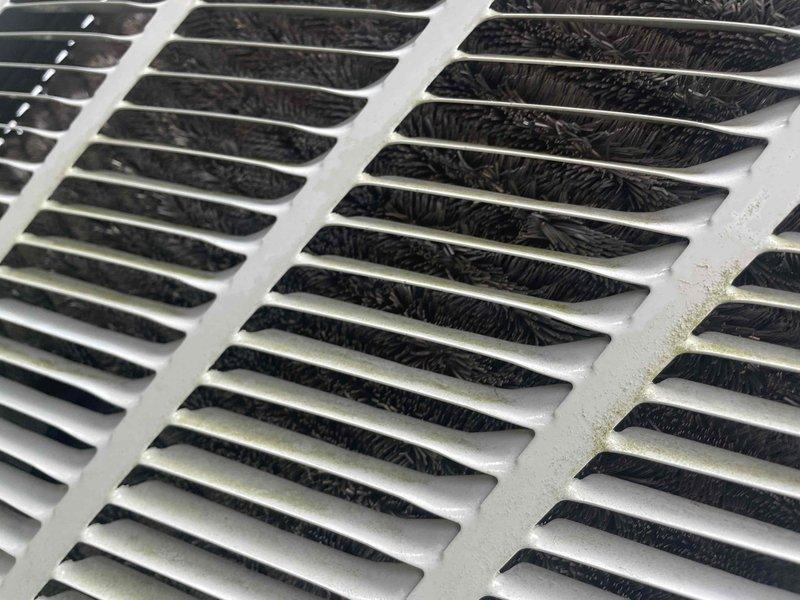 Completed comprehensive air conditioning tune-up on single ground-level unit. Performed standard maintenance protocol including inspection of blower assembly, fan housing, and internal components. Cleaned return air grille which showed moderate dust accumulation, and documented condition of blower housing and mechanical components with evidence of normal operational wear.
