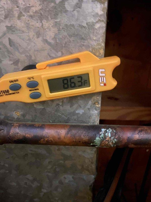 Responded to no cooling complaint on outdoor unit U10 located at back of residence. Upon arrival, found evaporator coil completely frozen with heavy ice accumulation. Measured supply air temperature at 61.9°F and return line temperature at 86.3°F, confirming restricted airflow condition. Instructed to turn off AC unit and leave fan running to allow coil to thaw completely. Return line showed signs of corrosion and oxidation requiring future attention. System requires follow-up visit after defrost cycle to diagnose root cause of freeze-up, which may include low refrigerant charge, dirty air filter, blocked return air, or failed blower motor.
